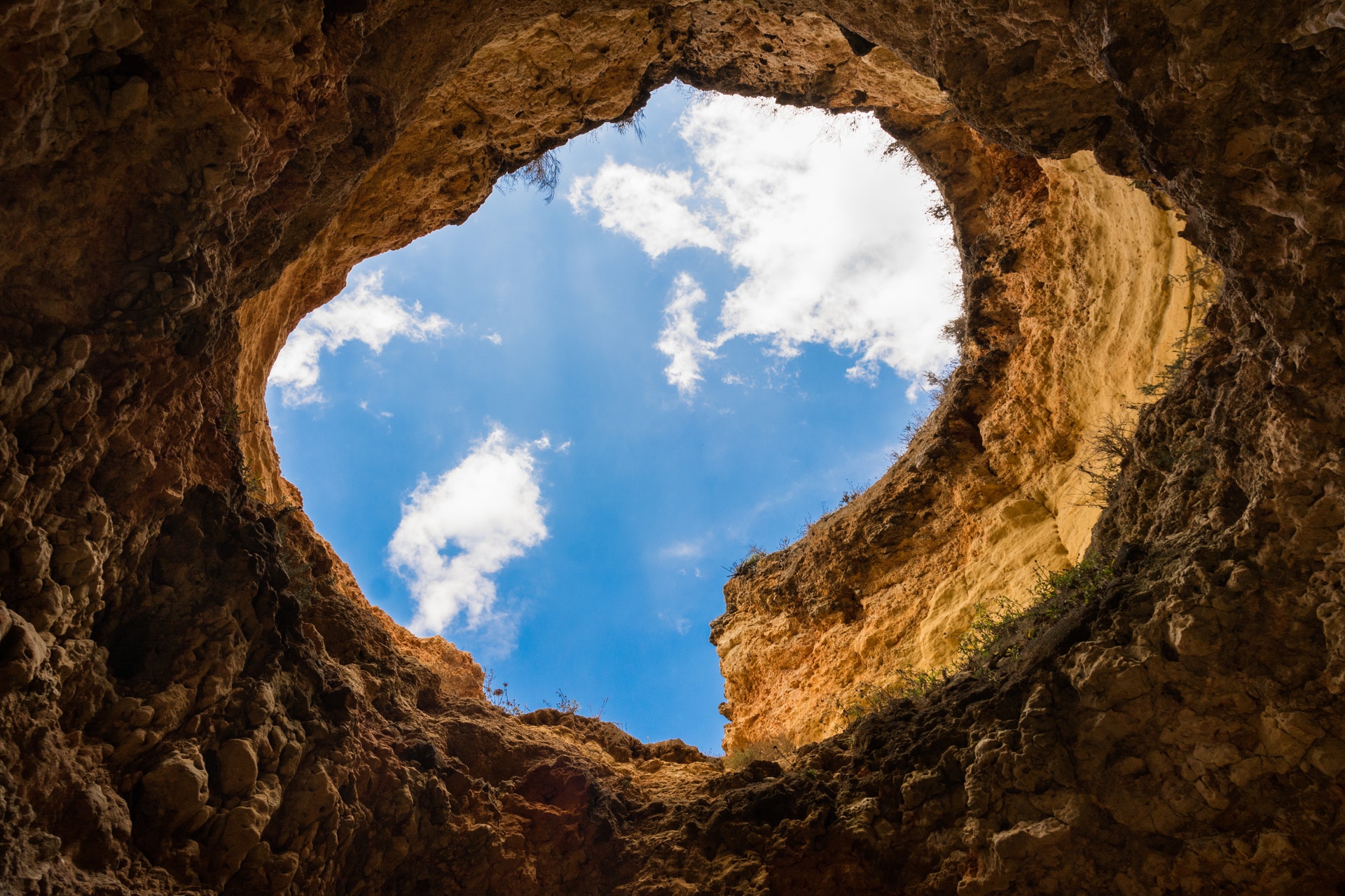 hole in earth looking up at sky
